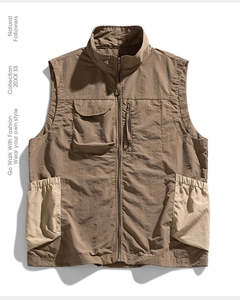 Close-up of khaki utility vest with multi-pocket design and ripstop fabric texture