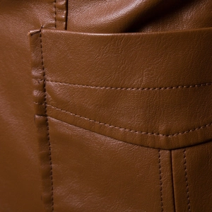 Detail of brown litchi pattern leather jacket featuring reinforced double-stitched pockets