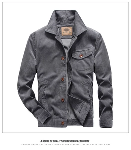Detail view of men's gray corduroy jacket showing lapel collar and chest pocket