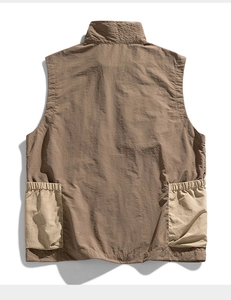Rear view of a khaki utility vest with color-block large pockets and stand collar