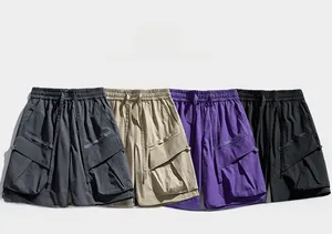 Flat lay of cargo shorts in four colors featuring elastic waist and large flap pockets