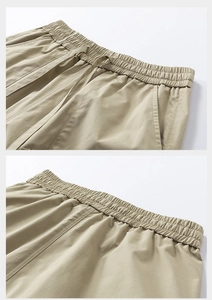 Detail of summer casual cargo shorts featuring elastic waistband and flat drawstrings