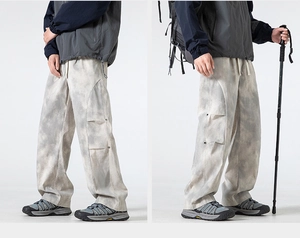 Detailed view of grey marble tie-dye cargo pants with unique 3D pleated side pockets