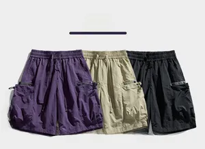 Detail showing cargo shorts in purple, khaki, and black with drawstring waist