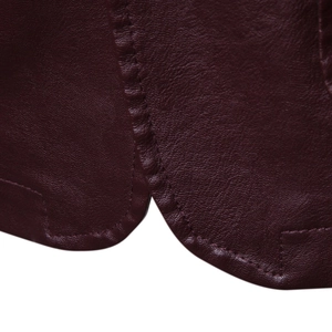 Macro view of stitching detail and lychee texture on burgundy PU leather biker jacket