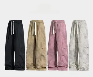 Detailed view of cargo pants showing four colors with elastic drawstring waist and side pockets