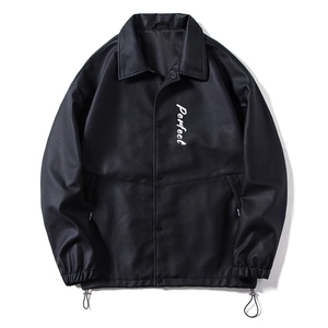 Detail view of black PU leather jacket featuring chest print and adjustable hem drawstring