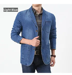 Detail of light blue denim blazer with notched lapel and vintage washed texture