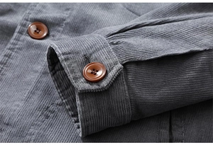 Detail of grey corduroy jacket cuff showing stitching quality and brown wooden buttons