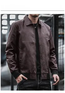 Close-up of deep brown leather jacket showing the ribbed cuffs and embossed chest logo