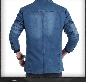 Detail showing elbow patches and back stitching on a slim-fit washed blue denim blazer