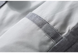 Detail view of corduroy patchwork on grey vintage cotton jacket with fine stitching