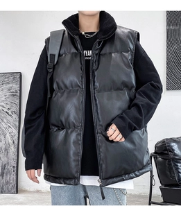 Detail of men's black PU leather puffer vest with warm shearling collar and zipper