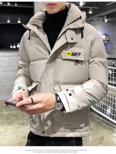 Detail of off-white hooded puffer jacket featuring a chest logo and quilted warm texture
