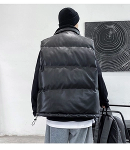 Rear view of man wearing thick black quilted leather vest with adjustable drawstring hem