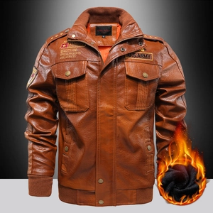 Detail view of brown flight jacket showing warm black fleece lining and army patches