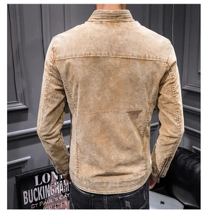 Detail view of mustard cotton denim jacket back with vintage washed finish and zip cuff