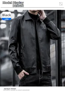 Detail of black faux leather jacket with ribbed cuffs and embossed chest embroidery