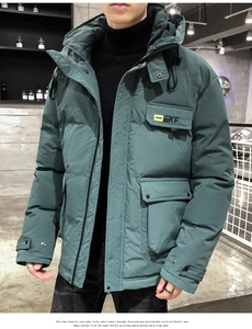 Detail view of men hooded jacket with KF badge and large utility pockets in dark green