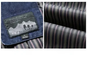 Detail view of denim jacket collar with brand label and striped fabric lining texture