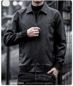Detailed close-up of 3D embossed AL logo on a black matte PU leather jacket