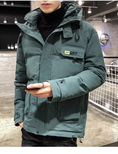 Detail of dark green hooded winter jacket featuring cargo pockets and yellow KF lettering