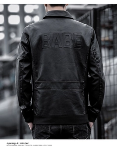Detail of the oversized BABE embossed 3D lettering on back of black faux leather jacket