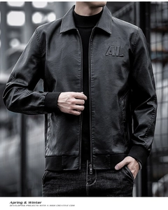 Detail of classic black PU leather jacket with AL embossed logo and metal zipper