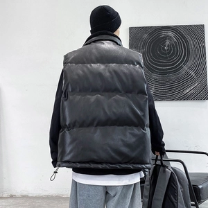 Men's stylish black leather puffer vest with wide quilting in a relaxed streetwear fit