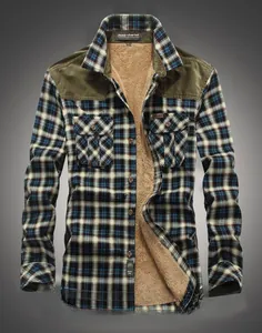 Detail of blue plaid shirt featuring soft sherpa lining and olive green shoulder patches