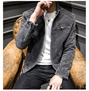 Detail shot of men's vintage washed denim jacket with premium metal zipper and pockets
