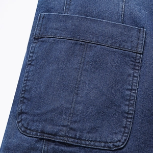 Deep blue denim jacket with detailed contrast stitching and functional flap pocket