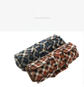 Detail view of winter plaid flannel shirts showing classic blue and orange checkered patterns