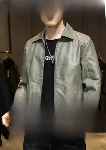 Detail view of a slim fit green PU leather jacket for men with a zipper front and pockets