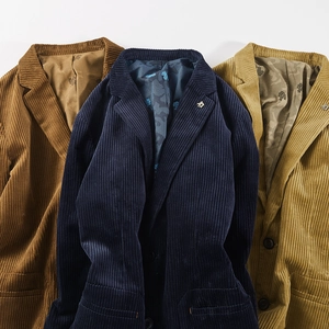 Detailed view of corduroy blazers in brown, navy, and khaki with maple leaf lining texture