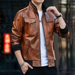 Close-up of brown leather biker jacket detail with ribbed collar and metallic zippers