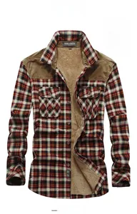 Detail of red plaid winter shirt featuring warm sherpa lining and corduroy shoulder patch