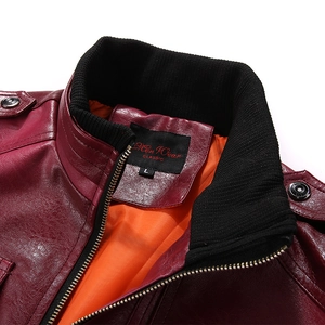 Detail shot of men's burgundy leather jacket showing knitted collar and orange lining