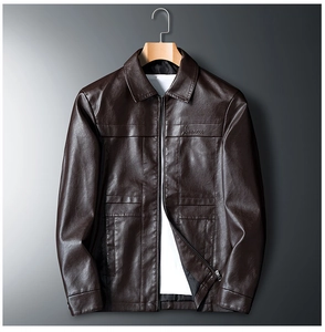 Close-up of brown PU leather jacket with embroidery detail and metal zipper