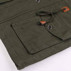 Macro detail of army green military jacket with canvas texture and utility pocket