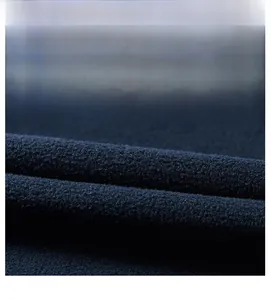 Close-up detail of soft polar fleece fabric with dense texture in navy blue color