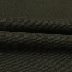 Macro shot of durable dark olive green twill fabric on a hooded mid-length cargo jacket