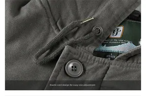 Detail of the heavy canvas fabric texture and sizing label on winter hooded jacket