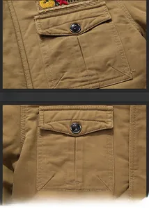 Détail de la veste tactique kaki montrant le tissu sergé et la poche de poitrine boutonnée