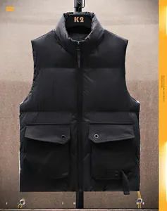 Close-up of black quilted puffer vest featuring stand collar and large utility flap pockets
