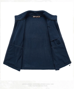 Detail view of deep blue fleece vest interior showing large functional inner pockets