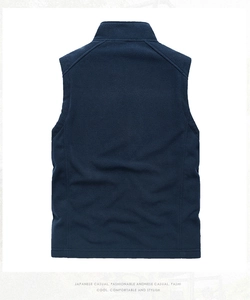 Macro detail of navy blue fleece vest back showing stitching and soft fabric texture