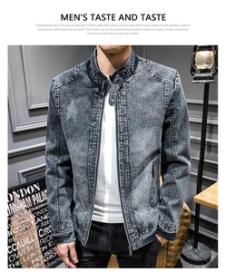 Detailed view of men's washed grey denim jacket with stand collar and zipper pocket