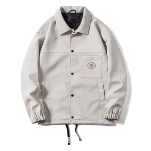 Minimalist beige PU leather jacket for men featuring a lapel collar and chest badge
