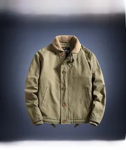 Detail of army green military jacket featuring warm fleece collar and A.R.M.Y. print